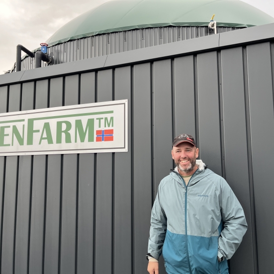 GreenFarmer Christian Hansen standing in front of his GreenFarm plant